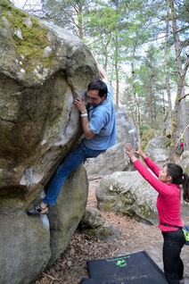 Climbing a compression style boulder problem in Fontainebleau