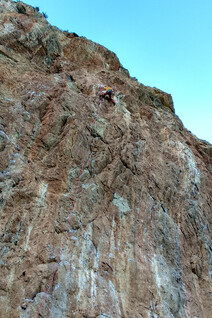 A closeup of a climber trying a 7c sport route at the main sector of Rincon Bello