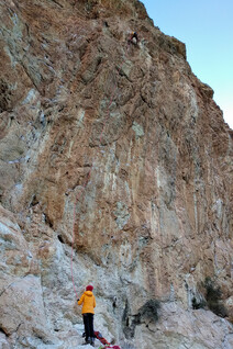 A climber trying a 7c sport route at the main sector of Rincon Bello