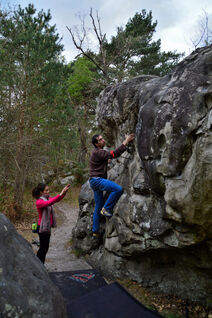 Climbing a relatively easy boulder problem in Fontainebleau