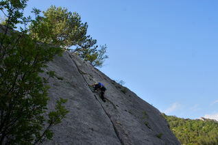 Almost at the top of a crack style sport climbing route in Vallee du Buech