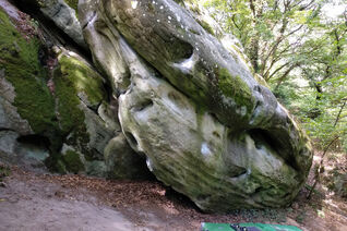 Pretty cool and futuristic looking boulder with many different problems on it in Fontainebleau