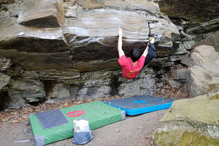 Traversing using a right heel hook a roof style boulder problem in Avalonia