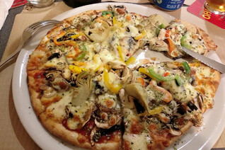 A closeup shot of a big vegetarian pizza