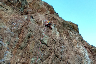 A closeup of a climber trying a 7c sport route at the main sector of Rincon Bello