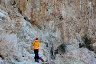 A climber trying a 7c sport route at the main sector of Rincon Bello